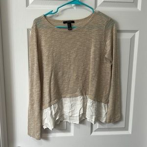 Cream colored blouse sweater.